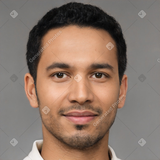 Joyful latino young-adult male with short  black hair and brown eyes