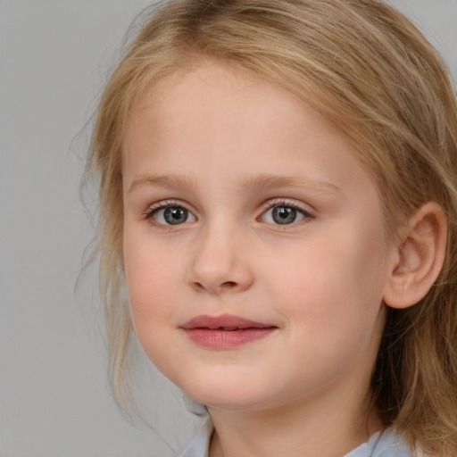 Joyful white child female with medium  brown hair and blue eyes