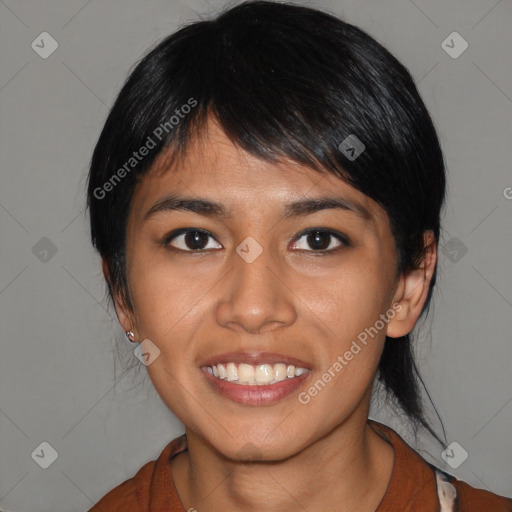 Joyful asian young-adult female with medium  black hair and brown eyes