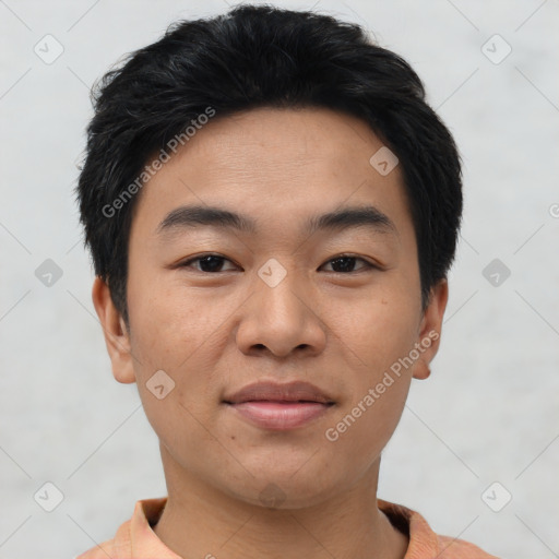 Joyful asian young-adult male with short  black hair and brown eyes