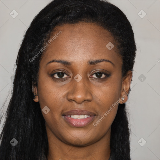 Joyful black young-adult female with long  brown hair and brown eyes