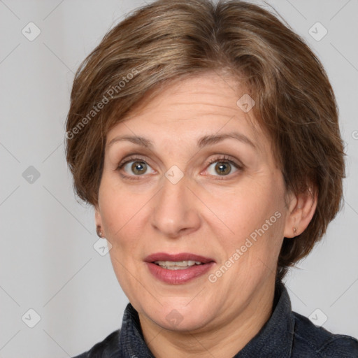 Joyful white adult female with medium  brown hair and grey eyes