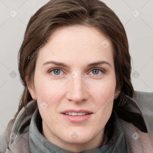 Joyful white young-adult female with medium  brown hair and blue eyes