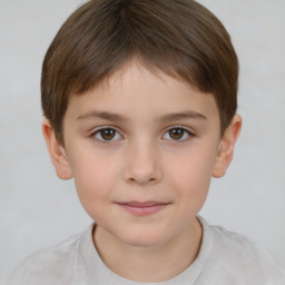 Joyful white child female with short  brown hair and brown eyes