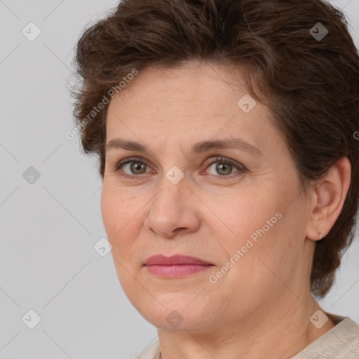 Joyful white adult female with short  brown hair and brown eyes