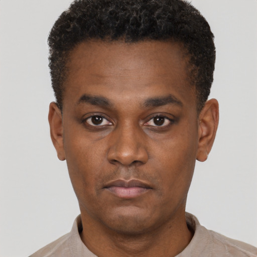 Neutral black young-adult male with short  black hair and brown eyes