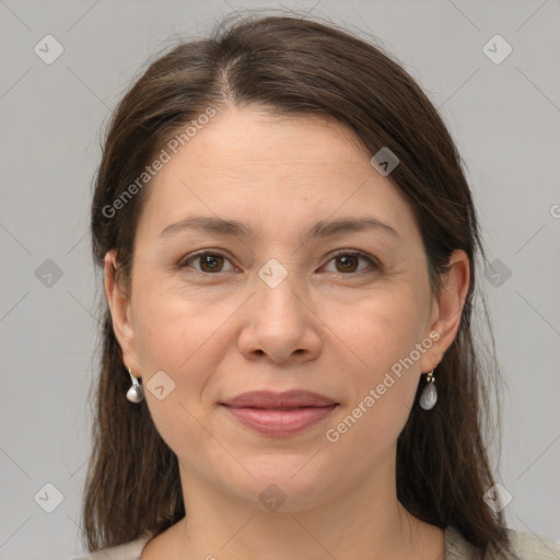 Joyful white adult female with medium  brown hair and grey eyes