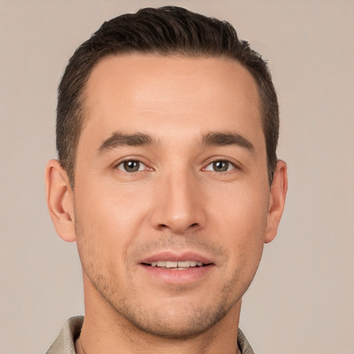 Joyful white young-adult male with short  brown hair and brown eyes