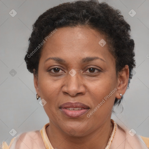 Joyful black adult female with short  brown hair and brown eyes