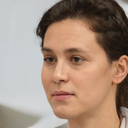 Neutral white young-adult female with short  brown hair and brown eyes