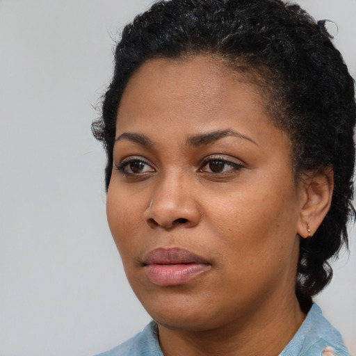Neutral black young-adult female with short  brown hair and brown eyes