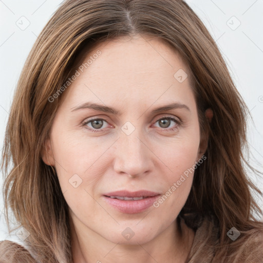 Joyful white young-adult female with long  brown hair and green eyes