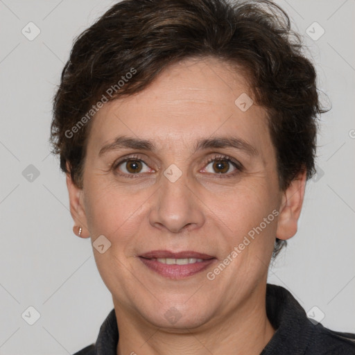 Joyful white adult female with short  brown hair and brown eyes