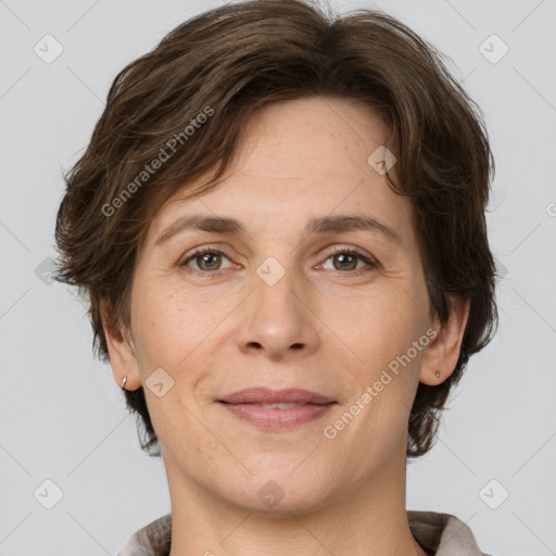 Joyful white adult female with short  brown hair and brown eyes