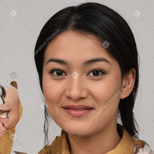 Joyful asian young-adult female with medium  black hair and brown eyes