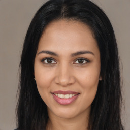 Joyful latino young-adult female with long  brown hair and brown eyes