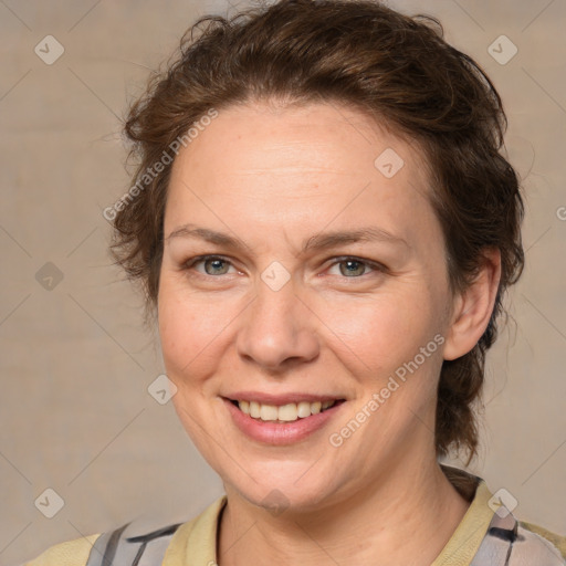 Joyful white adult female with medium  brown hair and blue eyes