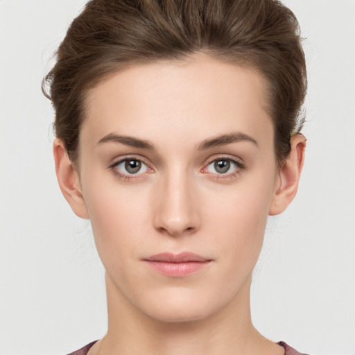 Neutral white young-adult female with short  brown hair and brown eyes