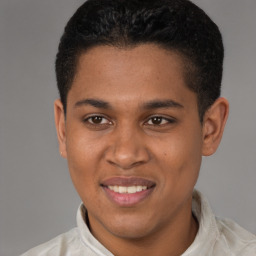 Joyful latino young-adult male with short  brown hair and brown eyes