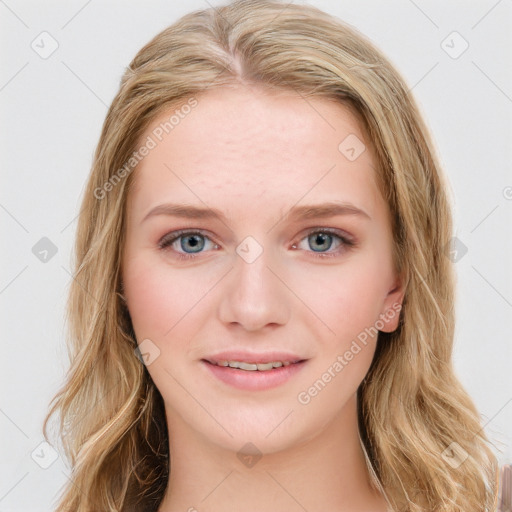 Joyful white young-adult female with long  brown hair and blue eyes