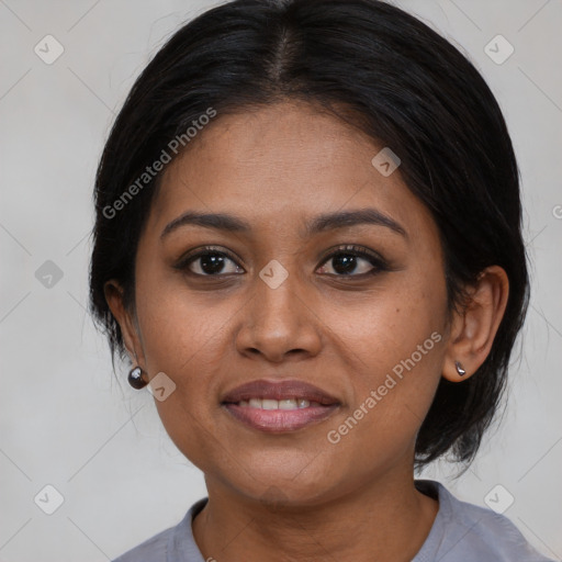 Joyful black young-adult female with medium  brown hair and brown eyes