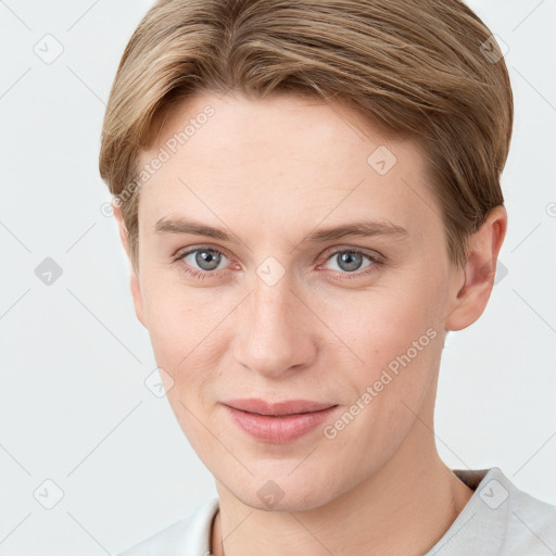 Joyful white young-adult female with short  brown hair and grey eyes