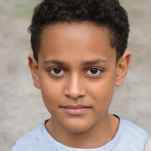 Joyful white child male with short  brown hair and brown eyes