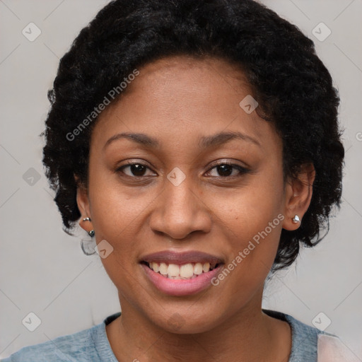 Joyful black adult female with short  brown hair and brown eyes