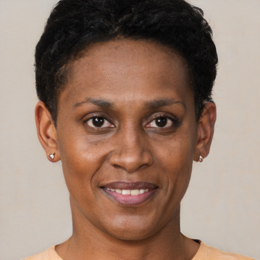 Joyful black young-adult female with short  brown hair and brown eyes