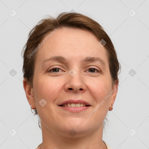 Joyful white adult female with short  brown hair and grey eyes