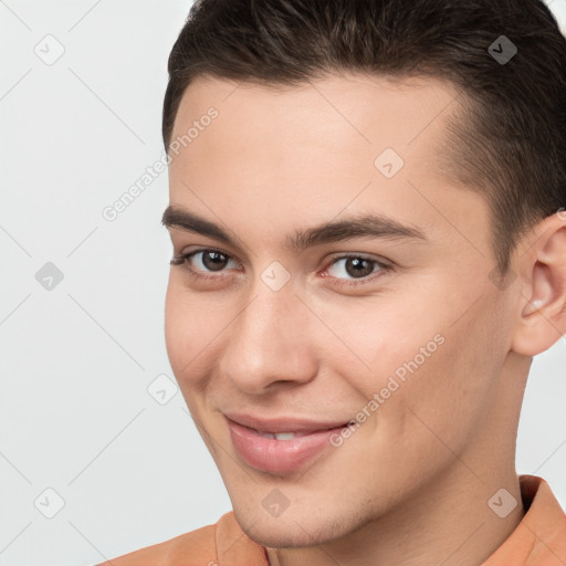 Joyful white young-adult male with short  brown hair and brown eyes