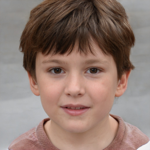 Joyful white child male with short  brown hair and brown eyes