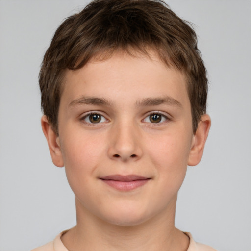 Joyful white child male with short  brown hair and brown eyes