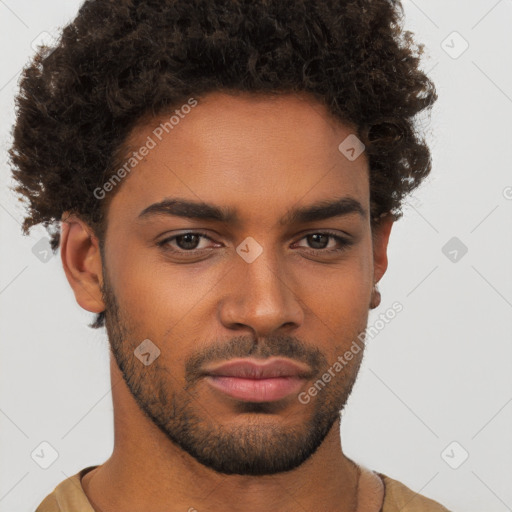 Joyful black young-adult male with short  brown hair and brown eyes