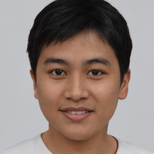 Joyful asian young-adult male with short  black hair and brown eyes