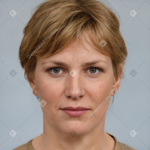 Joyful white adult female with medium  brown hair and grey eyes