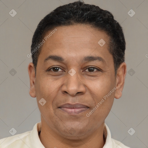 Joyful latino adult male with short  brown hair and brown eyes