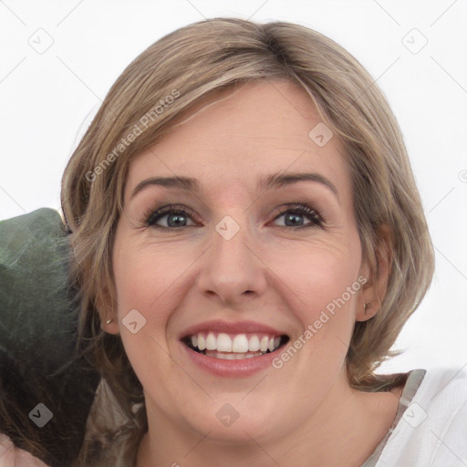 Joyful white young-adult female with medium  brown hair and green eyes