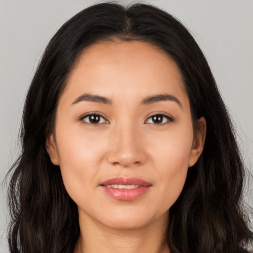 Joyful white young-adult female with long  brown hair and brown eyes