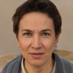 Joyful white adult female with short  brown hair and brown eyes