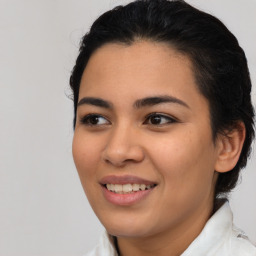 Joyful latino young-adult female with medium  brown hair and brown eyes