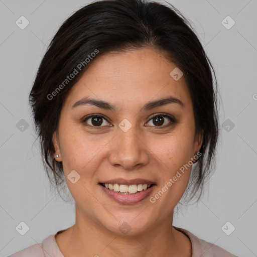 Joyful latino young-adult female with medium  brown hair and brown eyes