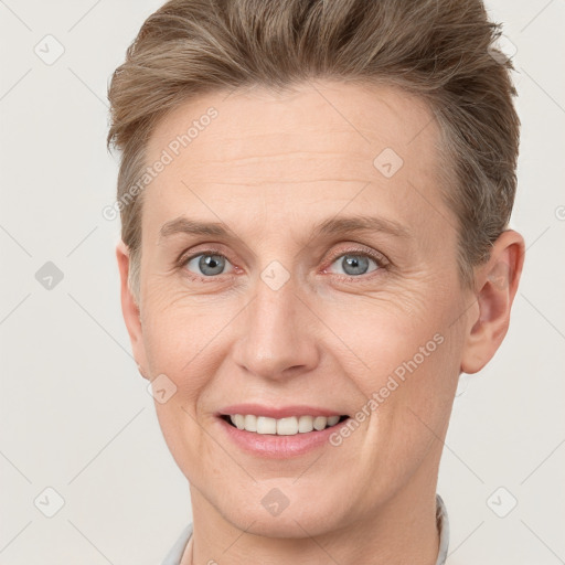 Joyful white adult female with short  brown hair and grey eyes