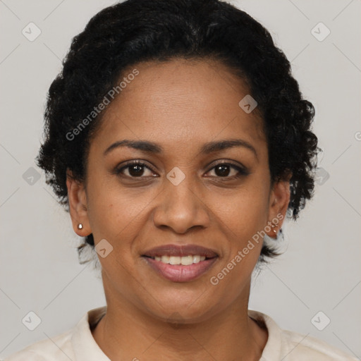 Joyful black adult female with short  brown hair and brown eyes