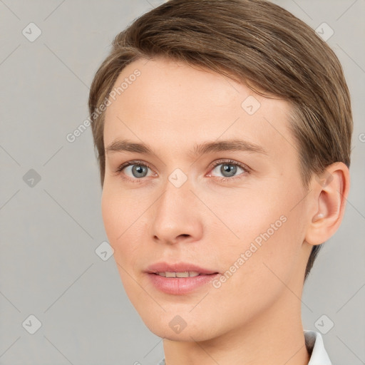 Joyful white young-adult female with short  brown hair and grey eyes