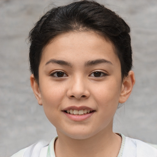 Joyful white child female with short  brown hair and brown eyes
