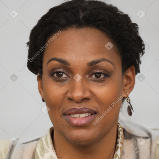 Joyful black adult female with short  brown hair and brown eyes