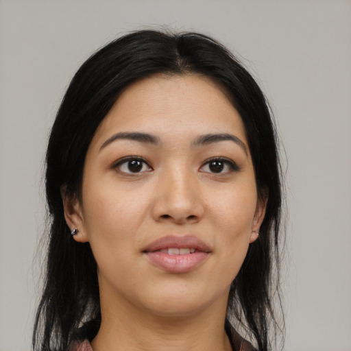 Joyful asian young-adult female with long  black hair and brown eyes