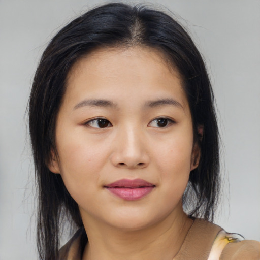 Joyful asian young-adult female with medium  brown hair and brown eyes