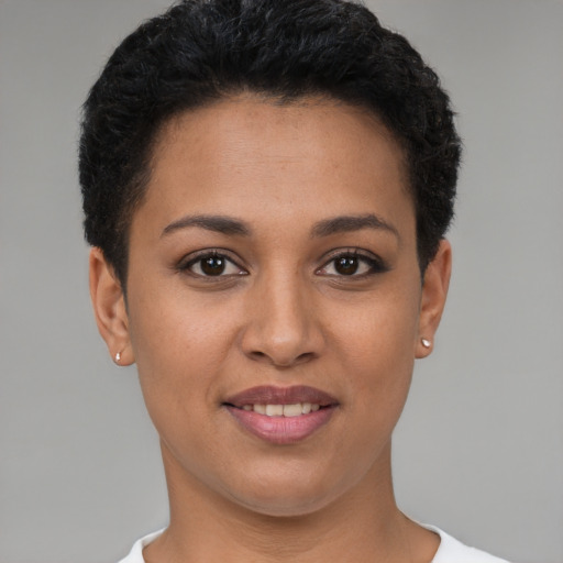Joyful white young-adult female with short  black hair and brown eyes